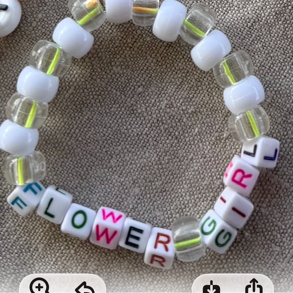 Jewelry - Flower girl with multi colored letter beads. White and clear beads as well .